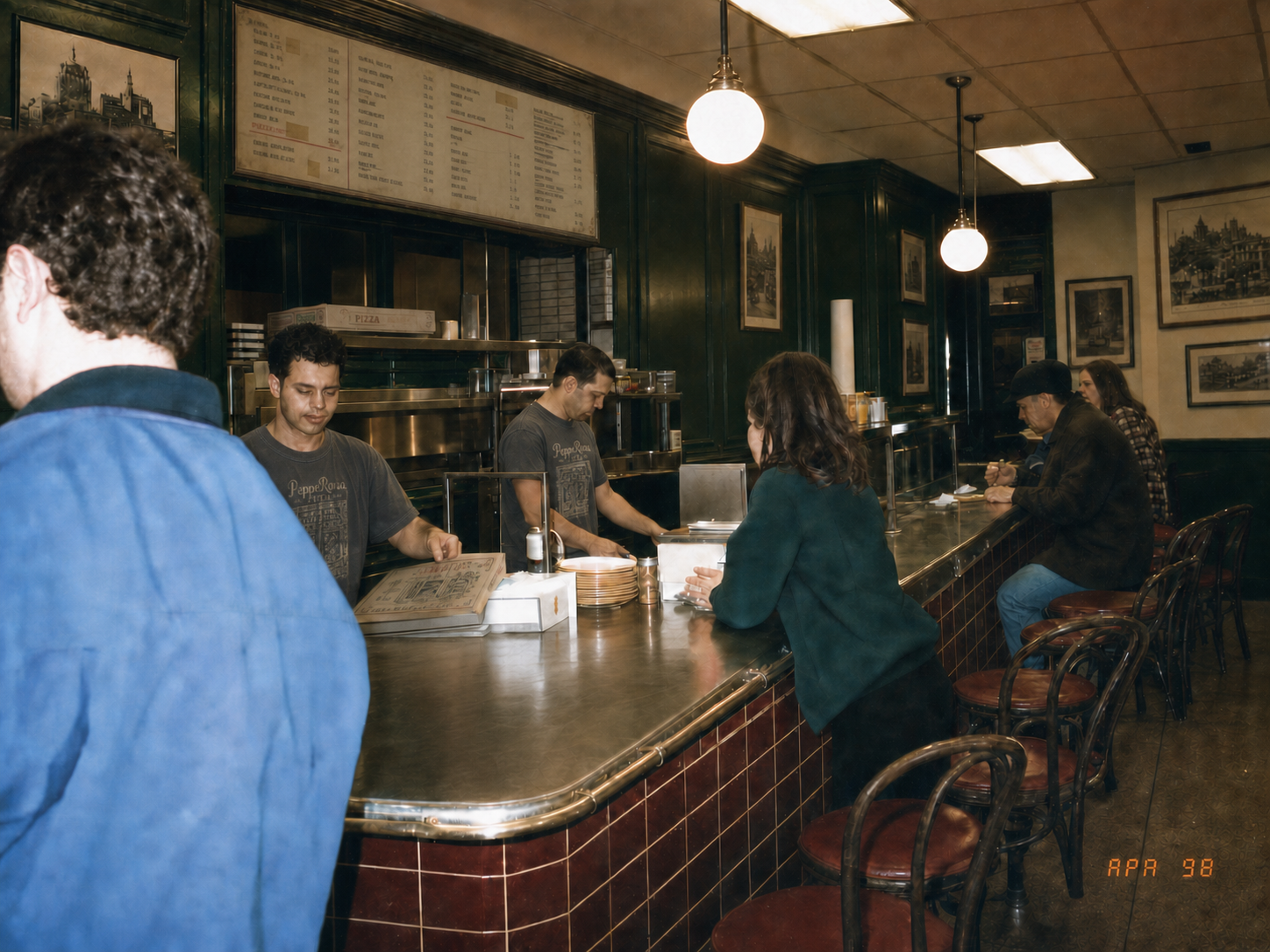 The counter at Pepperona Pizza during the afternoon rush